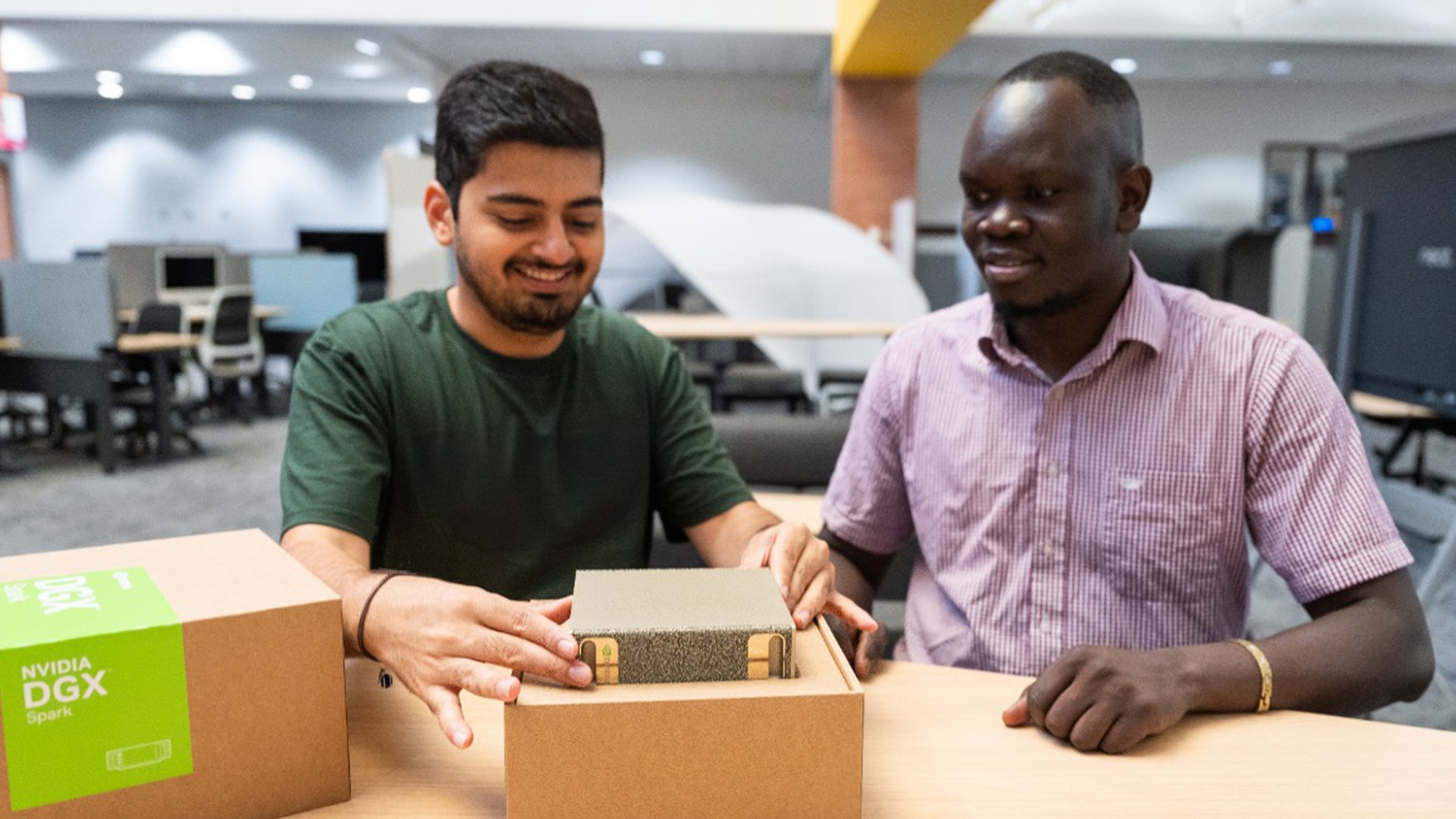 People unpacking their NVIDIA DGX Spark.