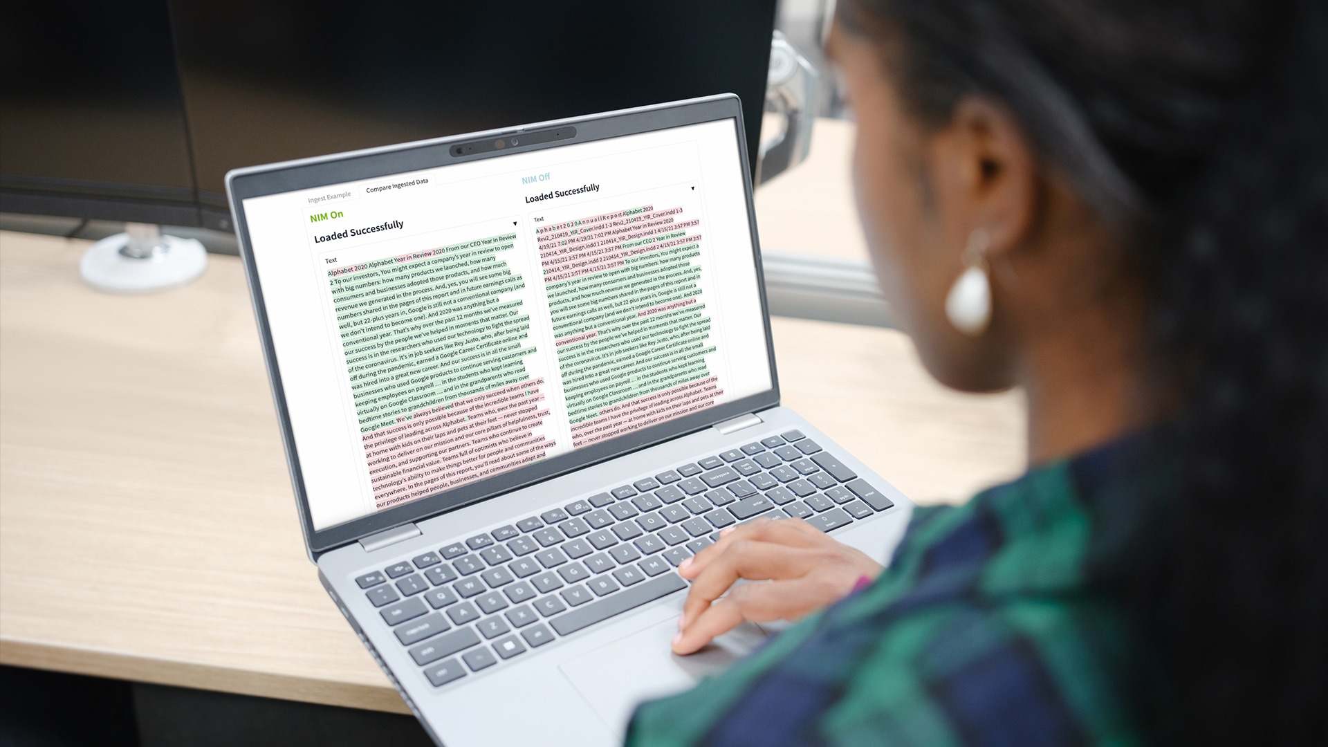 An image of a human using a laptop generating data using retrieval-augmented generation using NVIDIA NIM.